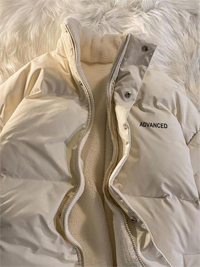 Arc | Veste courte matelassée unicolore avec col haut et fermeture éclair